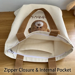Canvas tote bag with cute bear print featuring zipper closure and inner pocket