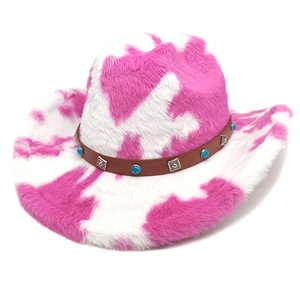 Pink and white cow print plush cowboy hat with turquoise western belt trim, 45-degree angle