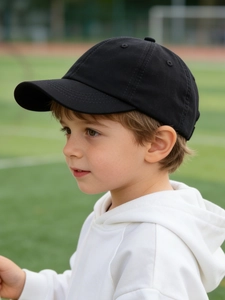 Detailed view of kids cotton twill baseball cap in black with reinforced brim stitching