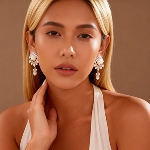 Elegant gold drop earrings with white resin pearls and sparkling crystals for women