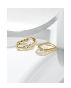 Detail of S925 silver gold hoop earrings with white pearl and sparkling zircon accents