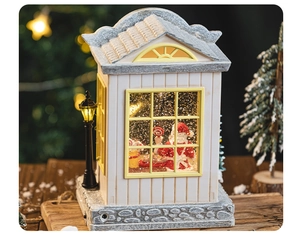 Detailed view of LED Christmas snow globe featuring Santa Claus in warm festive light