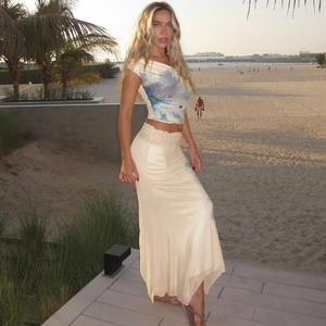Detail of floral crop top and satin fishtail skirt for summer beach vacation outfit