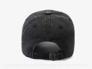 Detail view of adjustable metal buckle and washed denim strap on the back of the cap