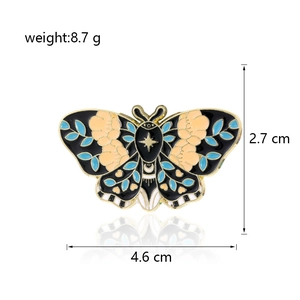 Detailed view of colorful butterfly enamel brooch with dimensions 4.6cm x 2.7cm and 8.7g weight