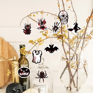 Halloween hanging ornaments with blood splatters on dry branches for party decoration