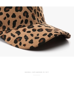Detailed close-up of leopard print corduroy baseball cap showing fine stitching texture