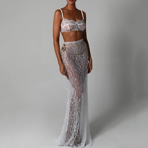 Elegant white lace two-piece set featuring a backless bralette top and a long fishtail skirt