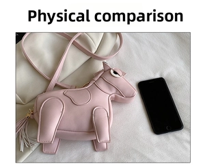 Pink pony shaped mini crossbody bag shown next to a smartphone for size reference