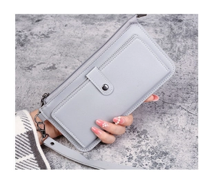 Close-up of light grey long faux leather wallet with lychee texture and wrist strap