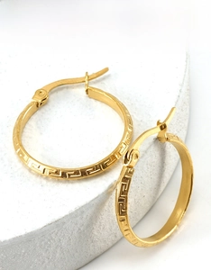 Detailed view of 18K gold plated stainless steel hoop earrings with Greek key pattern