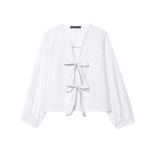 White poplin long sleeve shirt with black contrast stitching and decorative bow ties