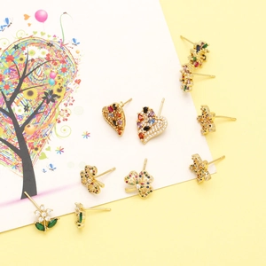Collection of gold stud earrings with colorful zircons in heart and flower shapes