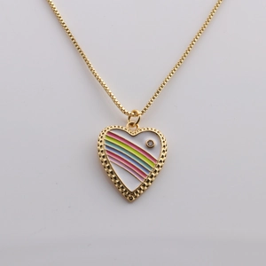 Detail of gold-plated heart pendant with rainbow enamel stripes and crystal on box chain