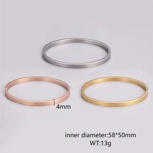Detail of 4mm wide brushed stainless steel oval bangle showing dimensions and metallic texture