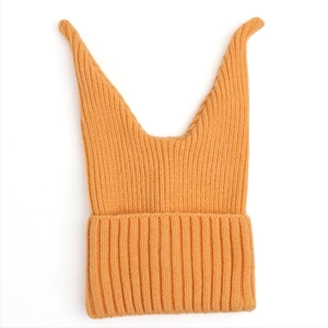 Detail of orange ribbed knit winter hat with cute cat ears and folded brim design