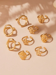 Detail of 9-piece gold-plated star and geometric adjustable open rings set