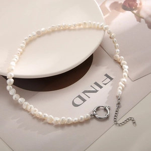 Detail of baroque freshwater pearl necklace with adjustable silver steel toggle clasp