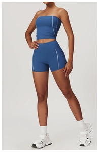 Detail of blue yoga set showing contrasting stitching and high-stretch athletic fabric