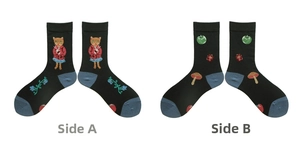 Detail view of cotton crew socks featuring orange cat illustration and botanical patterns