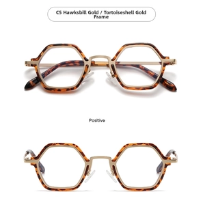 Dettaglio degli occhiali retro esagonali in oro Hawksbill con il modello di telaio E9006
