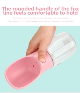 Macro view of portable pink pet water bottle with ergonomic one-hand button control