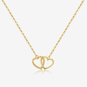 Detailed macro view of gold S925 silver necklace with interlocking heart pendants