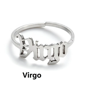 Macro shot of silver adjustable Virgo zodiac ring with elegant art font lettering