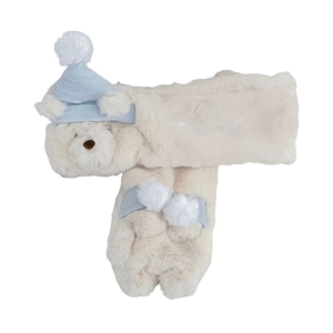 Plush bear scarf with blue sleeping cap on soft beige faux fur for winter warmth