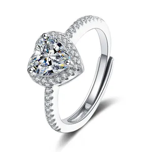 Detail of heart-shaped zircon ring with halo setting and adjustable silver band