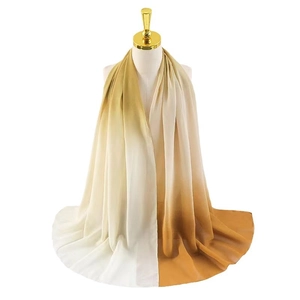 Lightweight chiffon scarf with beige to brown gradient on mannequin for sun protection