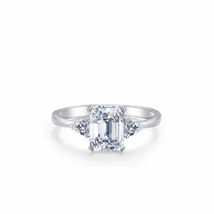 S925 sterling silver three-stone ring featuring emerald cut cubic zirconia center stone