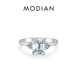 S925 sterling silver three-stone ring featuring emerald cut cubic zirconia center stone
