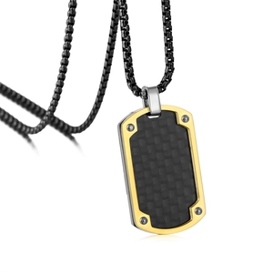 Detail of military dog tag pendant with gold plating and carbon fiber texture inlay