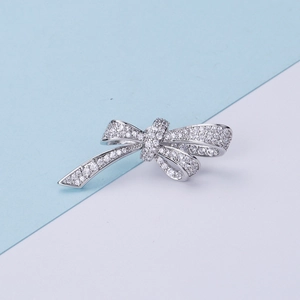 Elegant silver bow brooch pin with cubic zirconia inlay for women sweaters