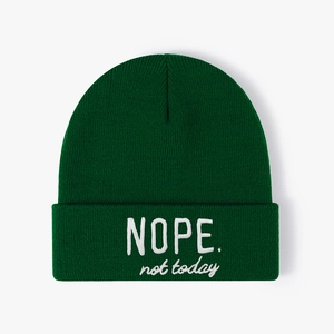 Dark green knitted beanie with white NOPE not today embroidery on the folded cuff