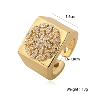 Macro view of 18K gold plated wide band ring with square face and inlaid zircons