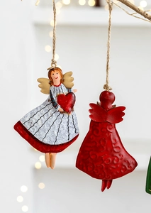 Detail of rustic iron Christmas angel ornaments with red heart and natural jute twine