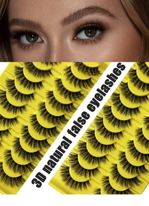 Macro shot of voluminous 3D natural false eyelashes in a yellow tray with model eye effect