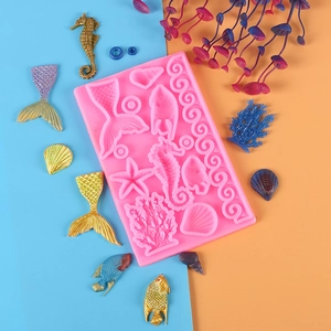 Pink mermaid tail silicone fondant mold with seahorse shell and coral detail patterns