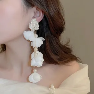 Elegant floral pearl long tassel earrings for women with white fabric petals and cascading beads