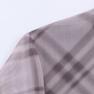 Detail of light purple-grey mesh fabric showing breathable knit texture and fine stitching