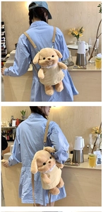 Girl wearing a light brown plush puppy backpack with a cream lace dress in a cafe setting