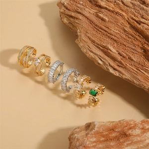 French vintage style gold and silver zircon rings set displayed on rustic wood