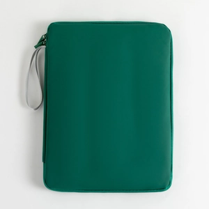 Detail of a dark green waterproof iPad sleeve with a gray fabric wrist strap and durable nylon
