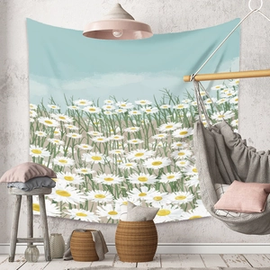 Detail of bohemian daisy floral tapestry hanging in a cozy macaron style bedroom
