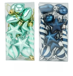 Detail of emerald green and midnight blue Christmas tree ornament sets in clear boxes