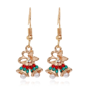 Detail view of festive gold Christmas bell earrings with red green rhinestones and pearls