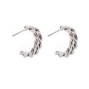 Detailed view of silver twisted rope hoop earrings with a dual braided texture design