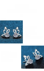 Macro detail of butterfly moissanite earrings with polished S925 sterling silver finish
